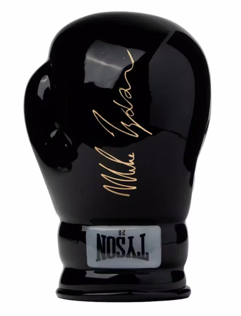 Black boxing glove with Mike Tyson's signature, showcasing premium sports memorabilia.